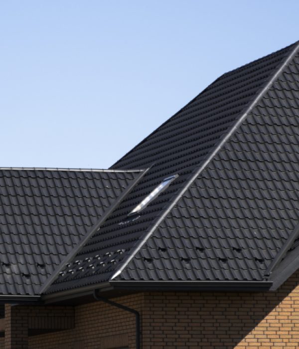 Brown Corrugated Metal Profile Roof Installed On A Modern House Brown Corrugated Metal Profile Roof Installed On A Modern House